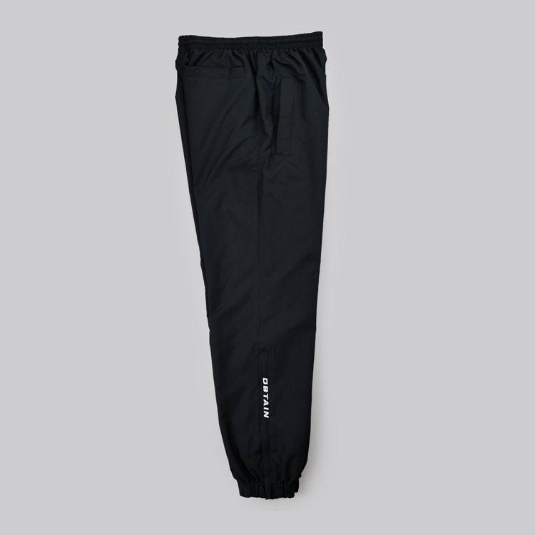 OBTAIN Trackpants. Color: black. Embroidered Logos. Sportswear.